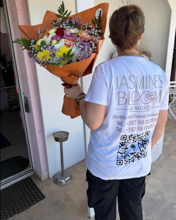 Jasmine&rsquo;s Bloom & More team delivering a bouquet